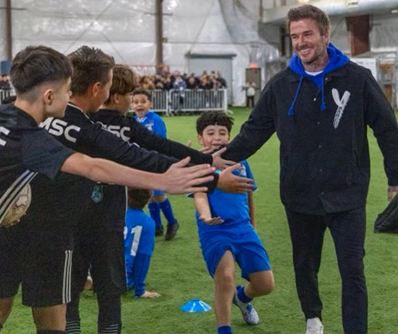 david beckham playing soccer with kids