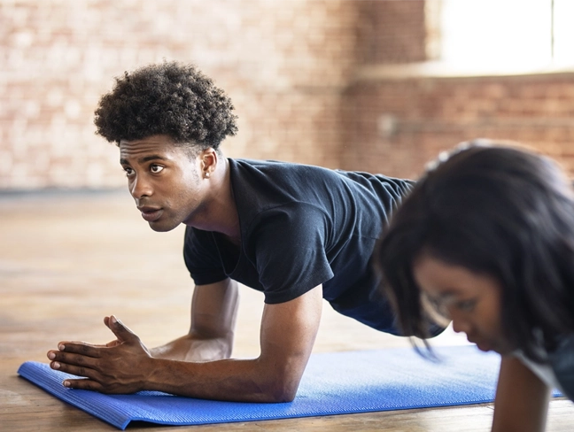 two people doing yoga