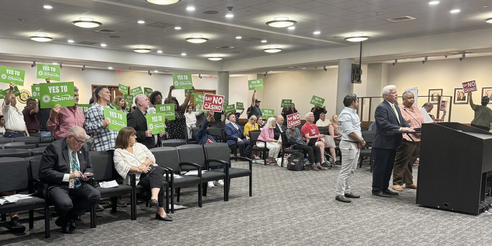 Organized labor members show support during meeting.